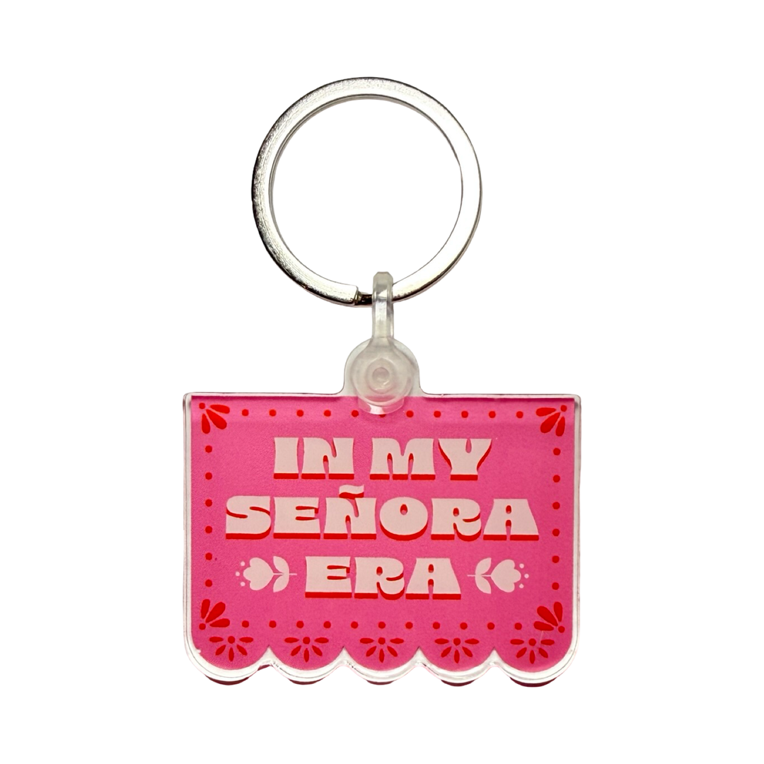 Pink papel picado style keychain reading "In My Señora Era.