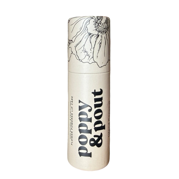 White tube of lip balm labeled “poppy & pout" has black thin line floral design on lid.