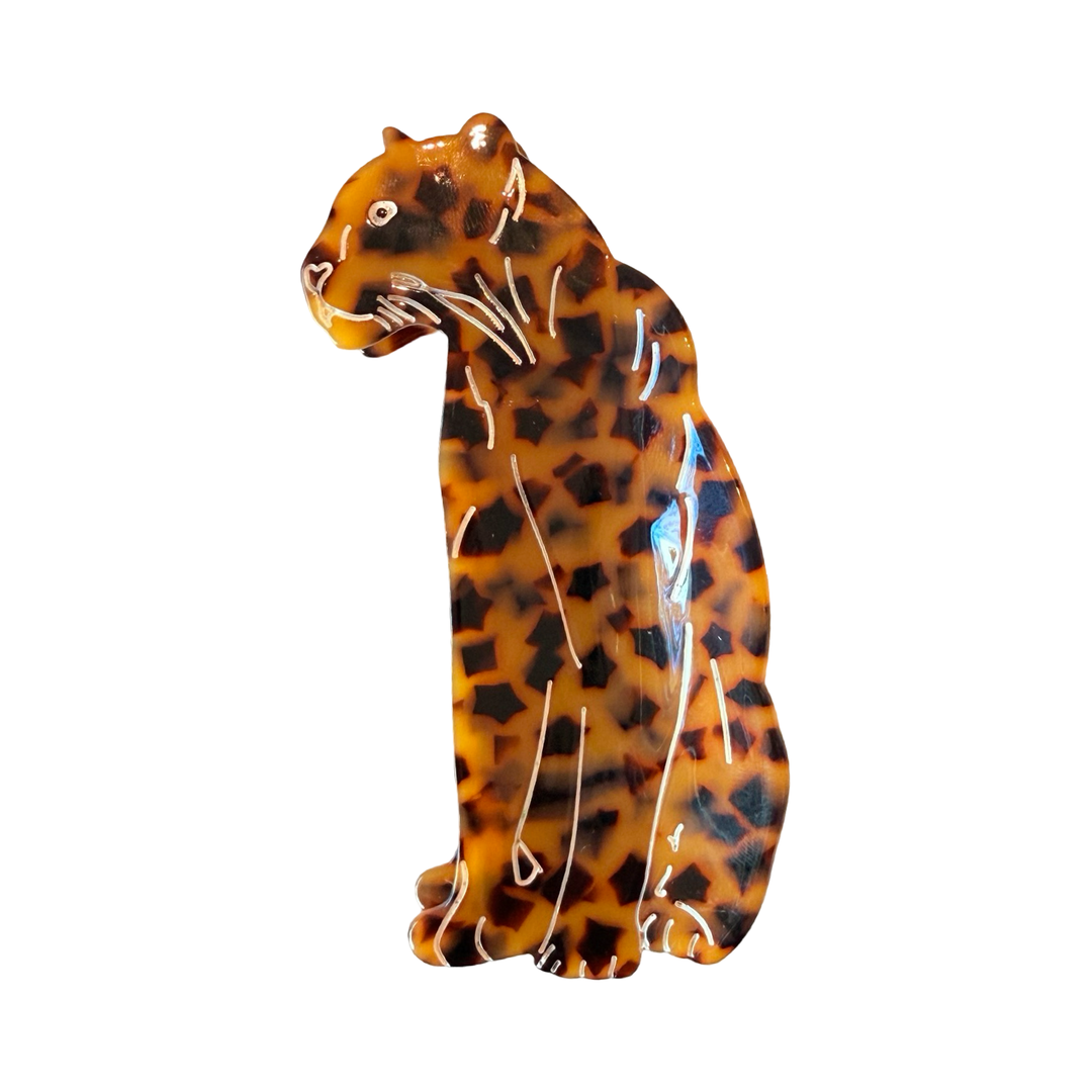 Brown and black jaguar shaped hair clip.