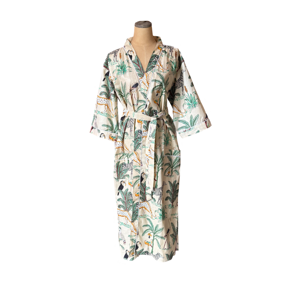 An ivory kimono-style robe with a jungle print featuring leopards, palm trees, and tropical birds