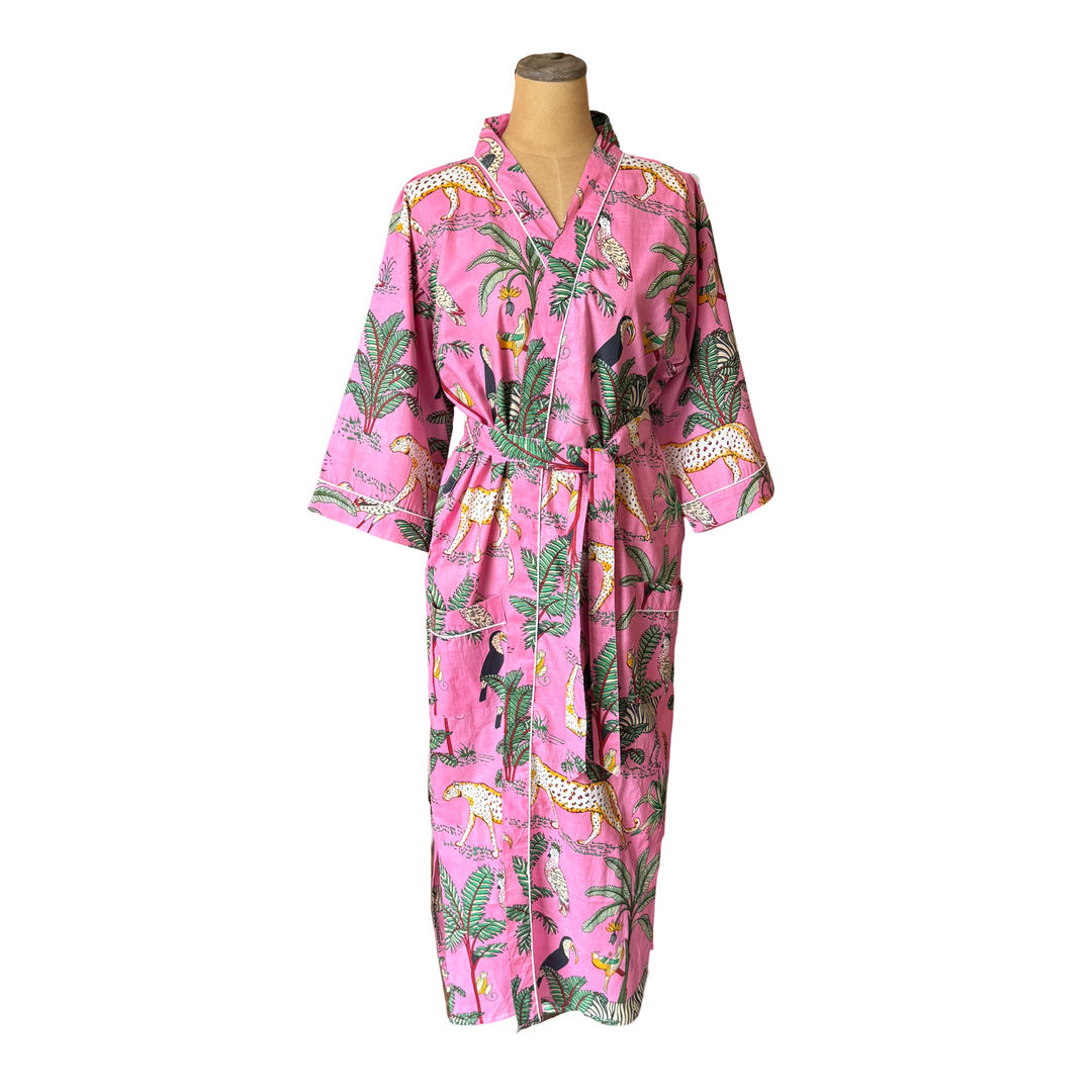 A pink kimono-style robe with a jungle print featuring leopards, palm trees, and tropical birds.