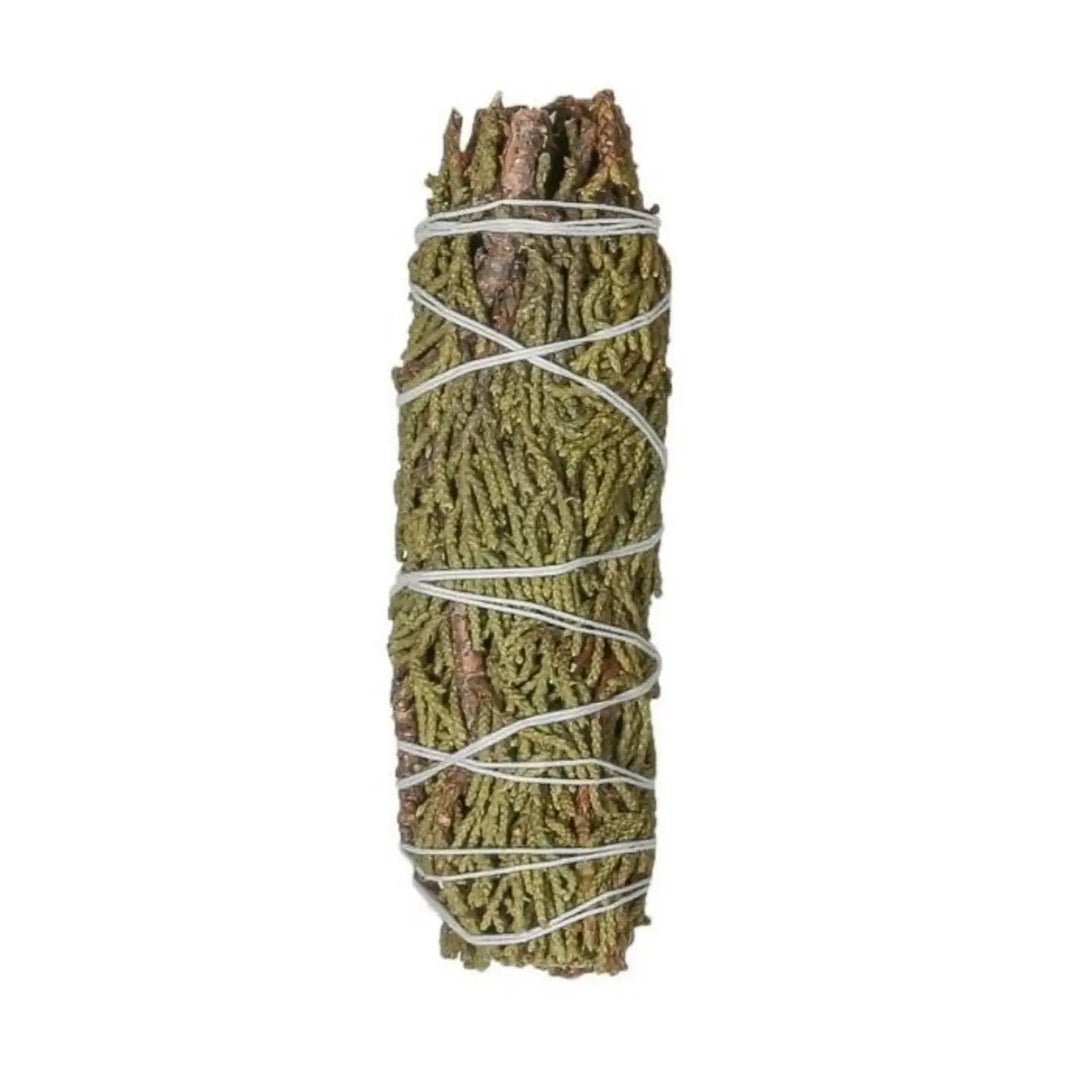 Bundled juniper herb wand wrapped with white string, featuring natural green branches tied into a smudge bundle.