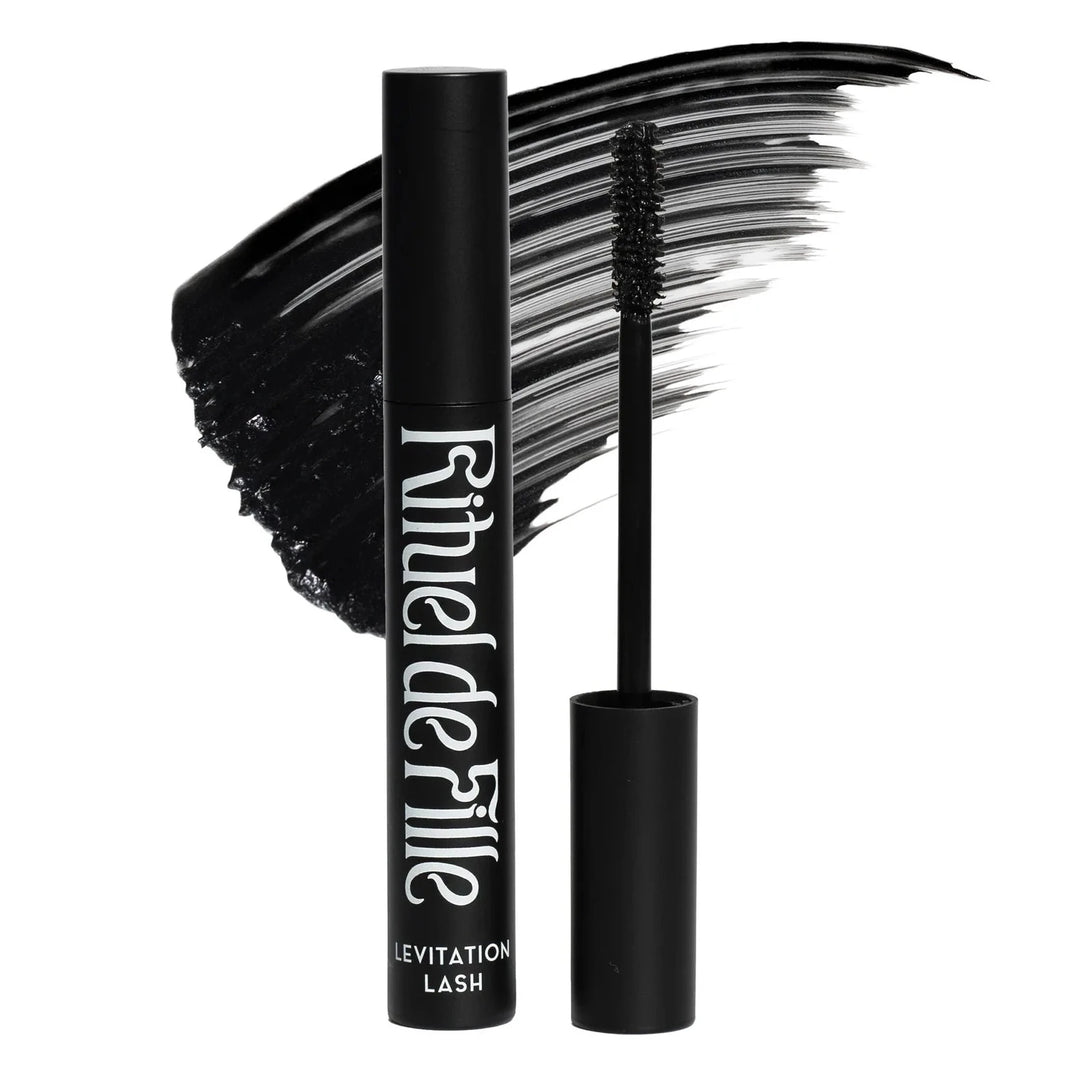 black tube of black mascara with white lettering and a swatch of the mascara behind it. Brand: Rituel De Fille