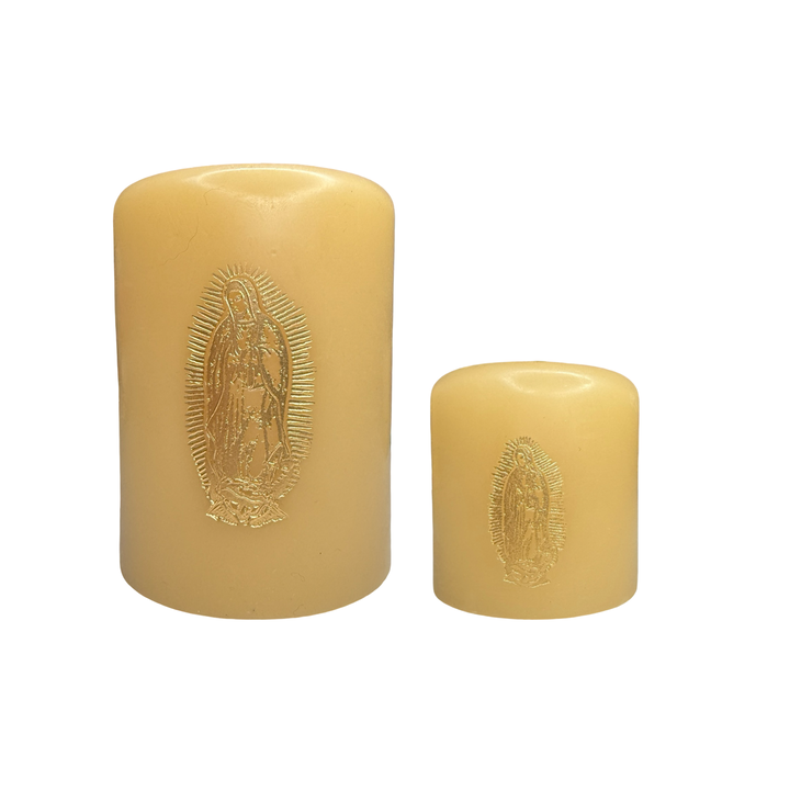 Two ivory candles, one large and one small, each featuring a gold foil stamped image of Our Lady of Guadalupe on the front.
