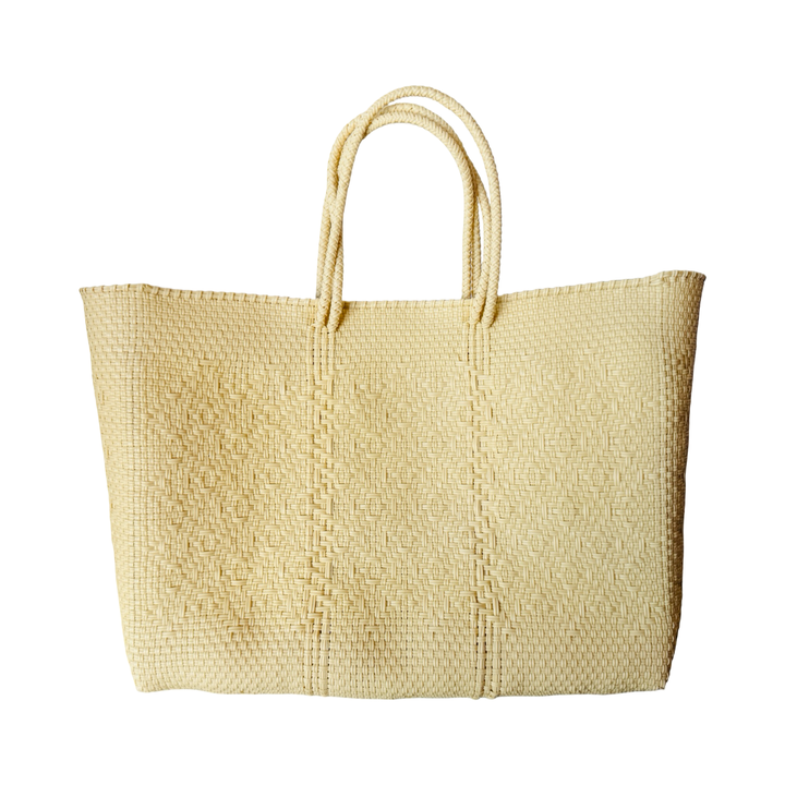 cream recycled plastic woven tote featuring a unique weaved pattern and braided handles.