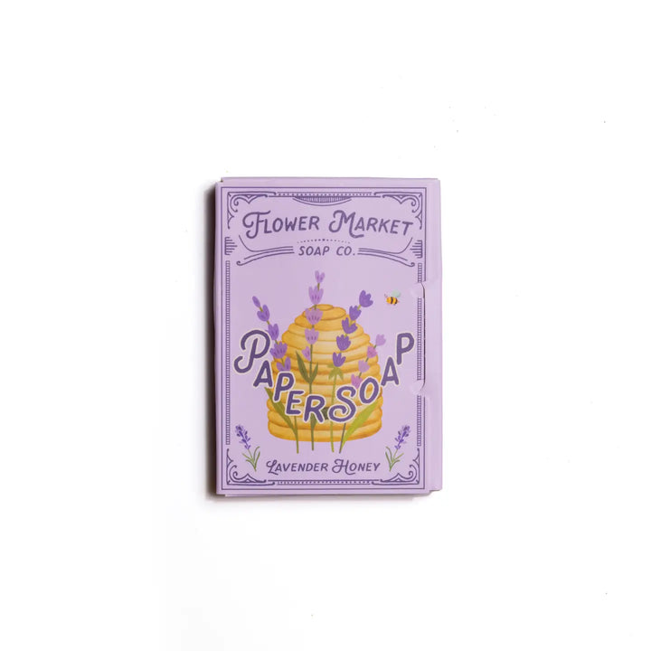 A package of Flower Market Soap Co. paper soap with lavender and honey theme, featuring an illustration of a honeycomb and lavender flowers.