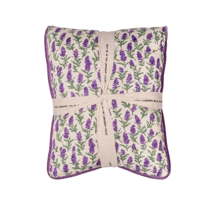 Lavender print pillow tied with a cream ribbon bow.