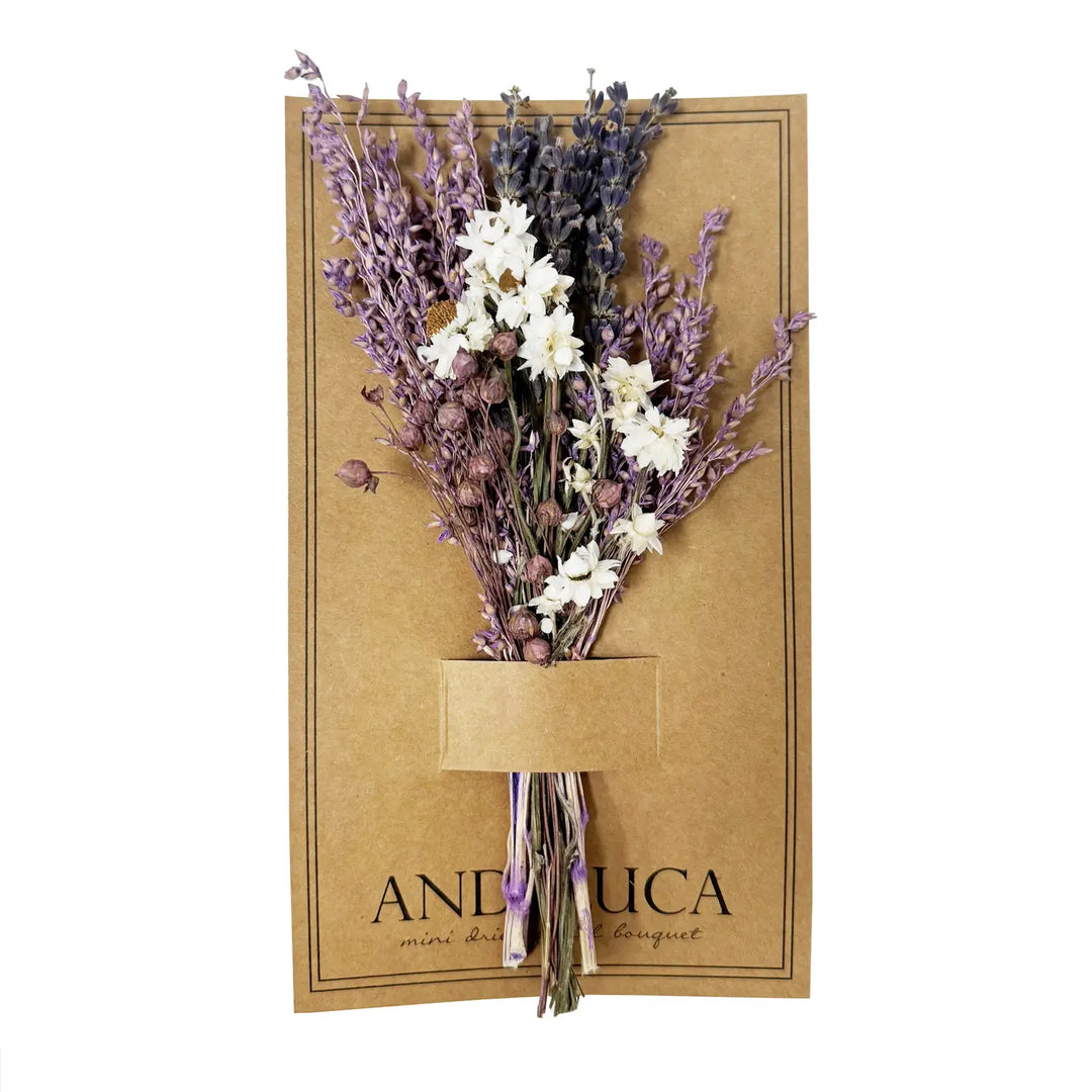 Mini bouquet of dried lavender, white flowers, and wildflower accents displayed on kraft paper backing.