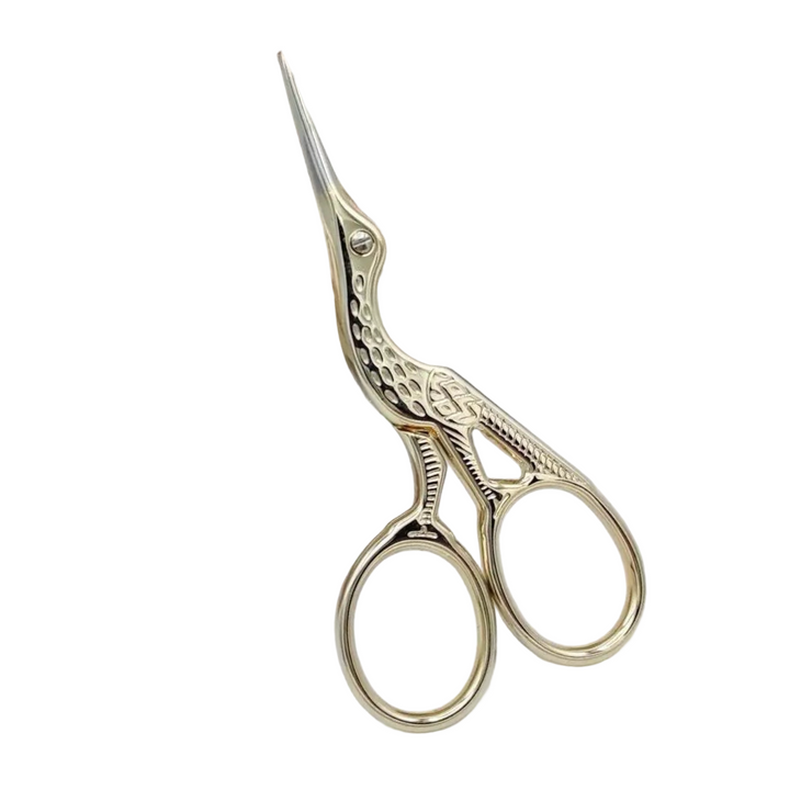 Light gold stork shaped scissors