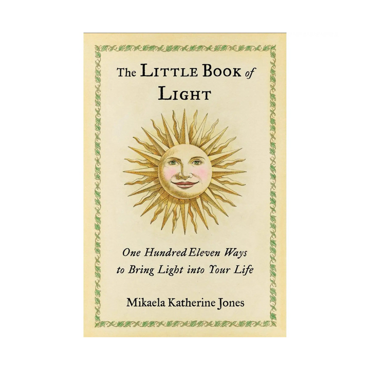 Book titled 'The Little Book of Light' features light yellow cover with illustrated image of a radiating sun with facial features. A delicate green leaf design borders the light yellow cover. Book title, content description and author are listed at the top and bottom in black text.