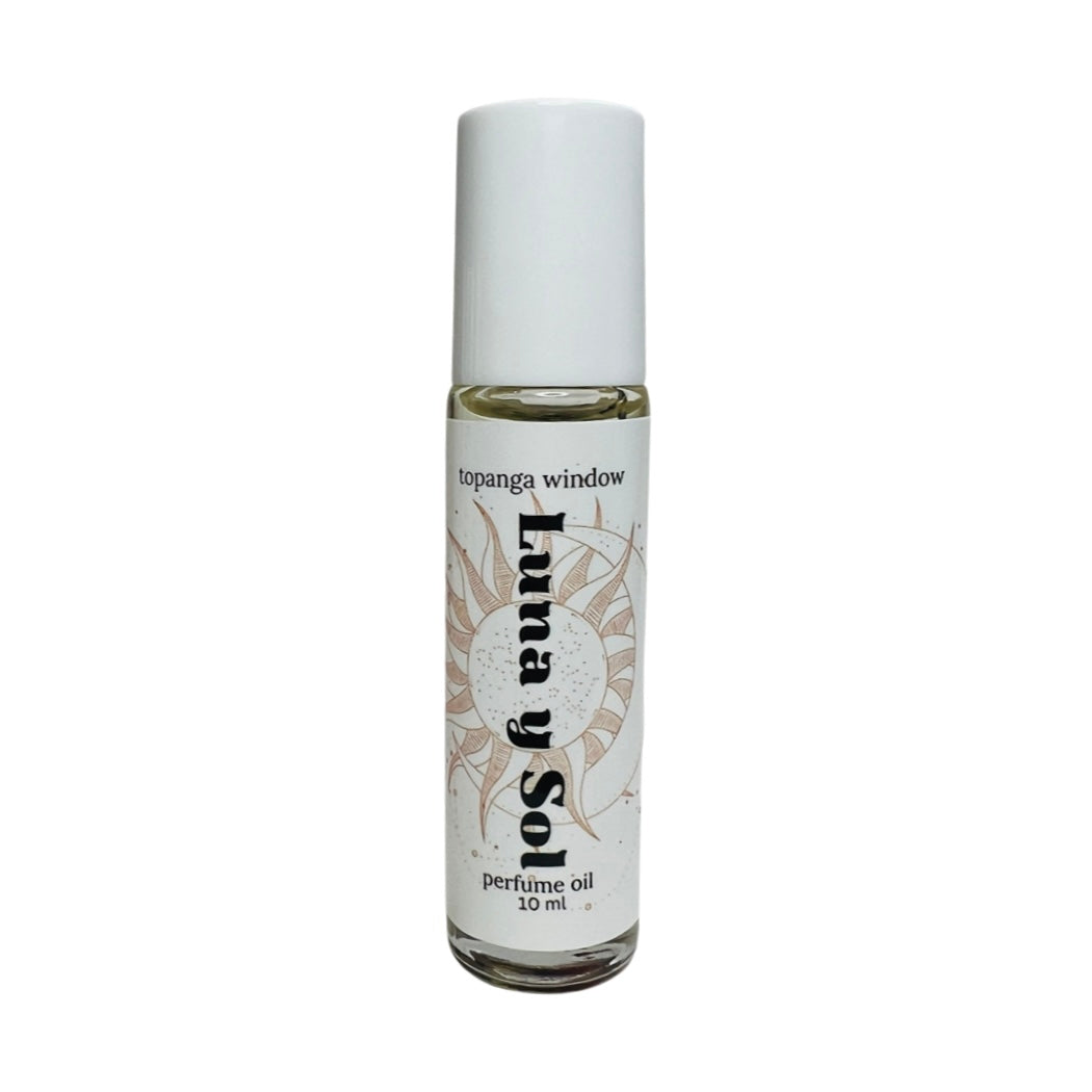 10 mil glass tube of perfume oil with a white branded label. Brand: Topanga Window