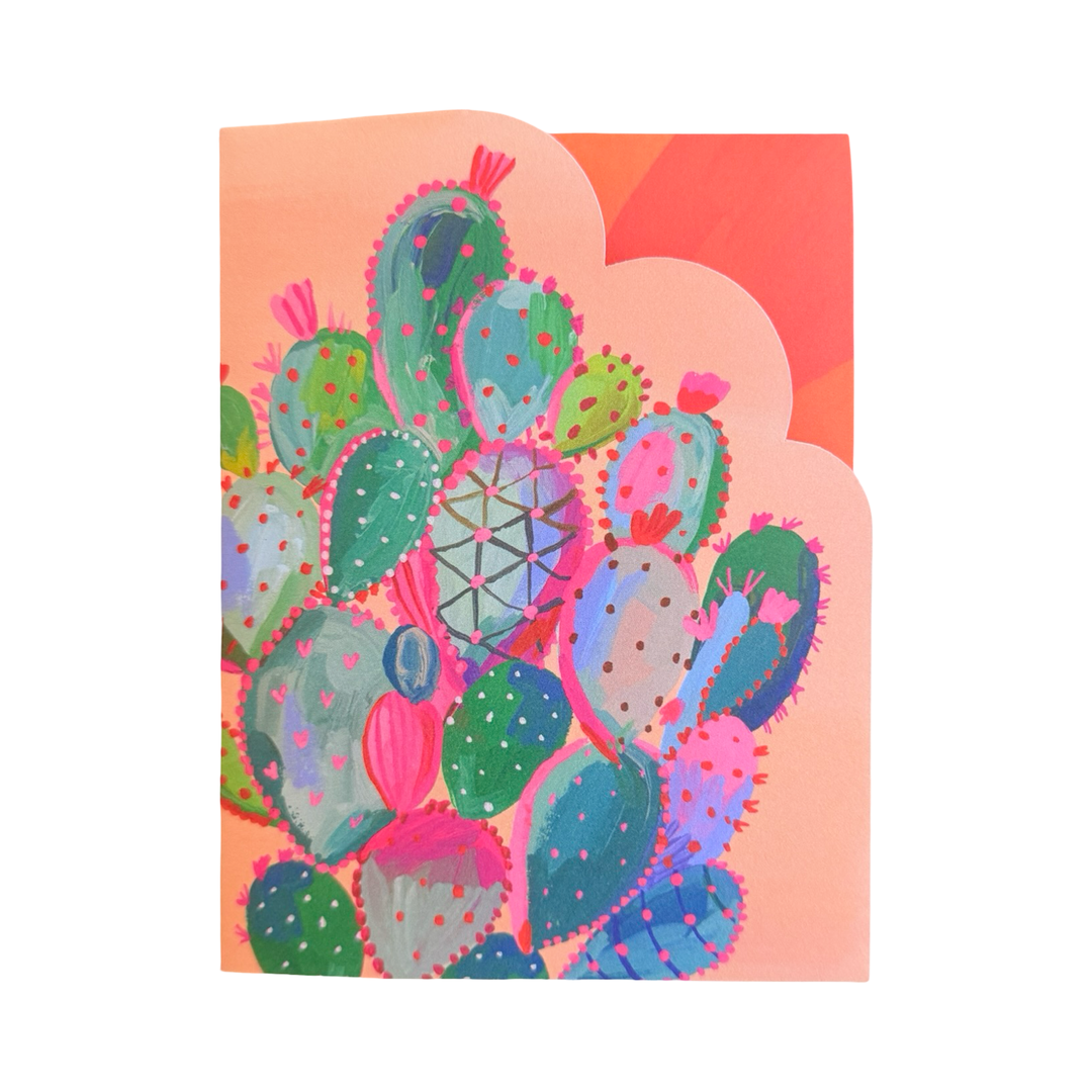 Greeting card featuring a colorful illustration of a prickly pear cactus cluster with scalloped edges and a soft peach background.