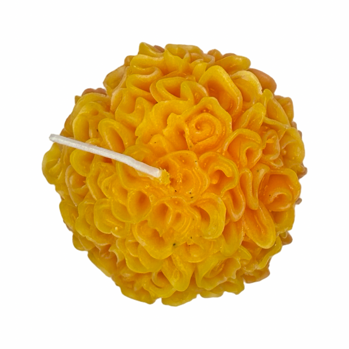 Marigold shaped candle in light orange