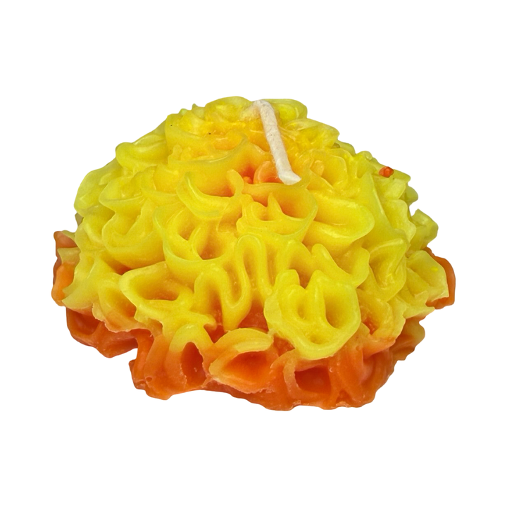 side view of a Marigold shaped candle in orange and yellow