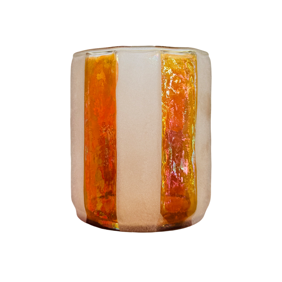 Cylindrical glass votive holder with vertical alternating frosted stripes and iridescent amber-gold panels, shown on a white background.