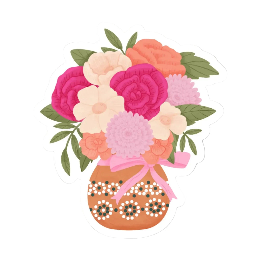A die-cut sticker featuring an illustrated floral bouquet of peonies, dahlias, and ranunculus in shades of magenta, peach, cream, and lavender with green leaves, arranged in a terracotta vase decorated with dot patterns and tied with a bow.