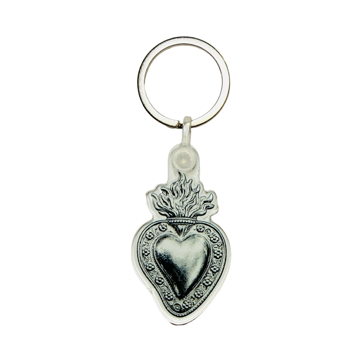 Silver milagro keychain with an ornate flaming sacred heart design.