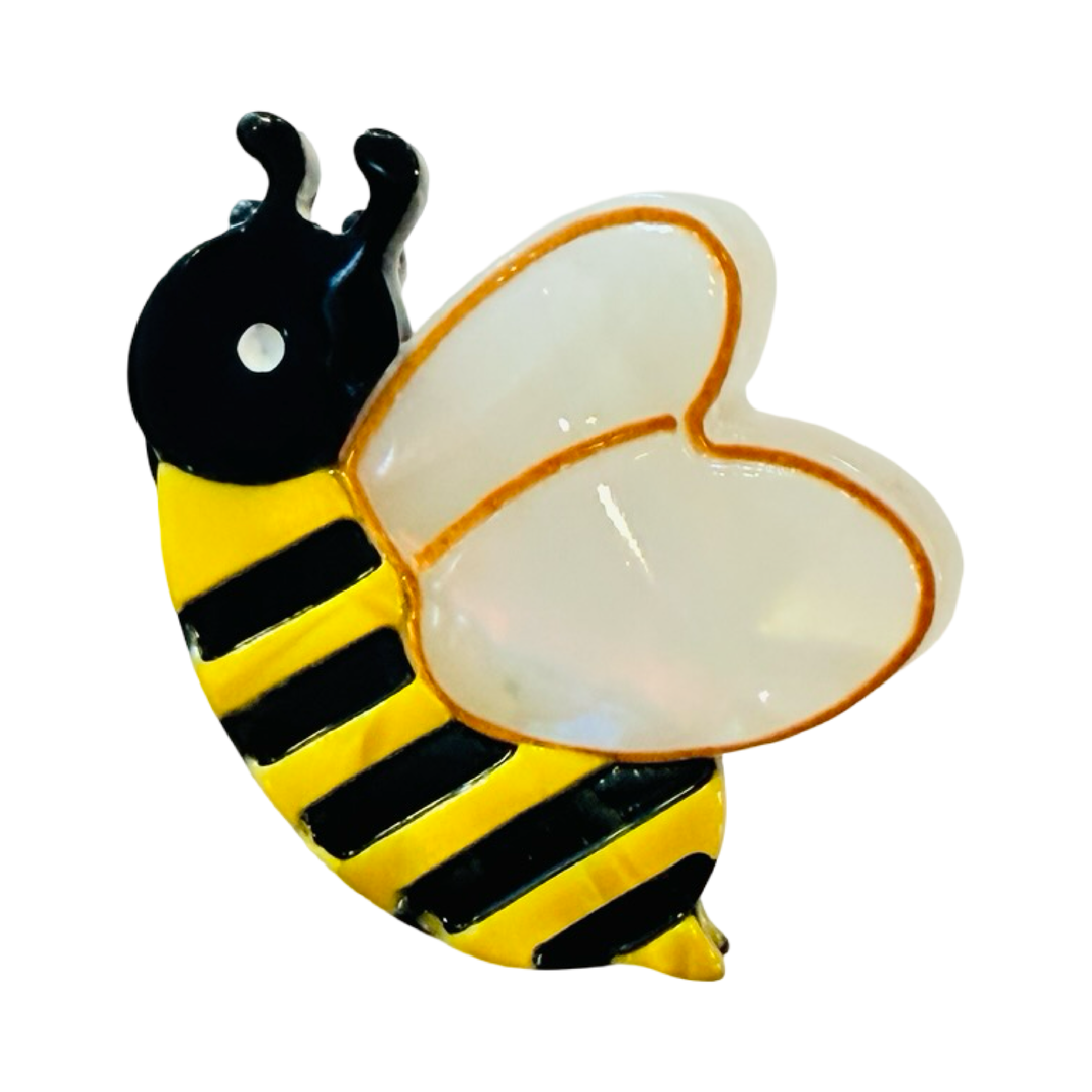 Photo of mini hair clip resembling bumblebee.