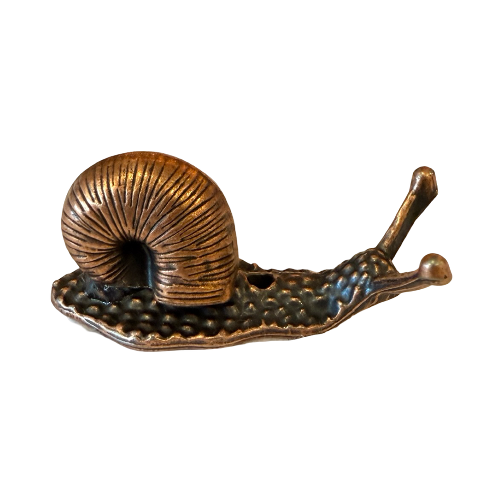 bronze colored figurine of a snail