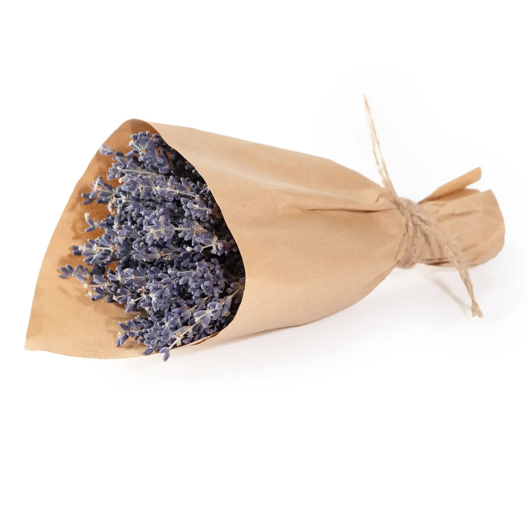 Small bundle of dried French lavender wrapped in kraft paper and tied with rustic twine.