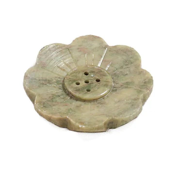 Soapstone incense holder shaped like a lotus flower with petal detailing and multiple small holes in the center for holding incense sticks.