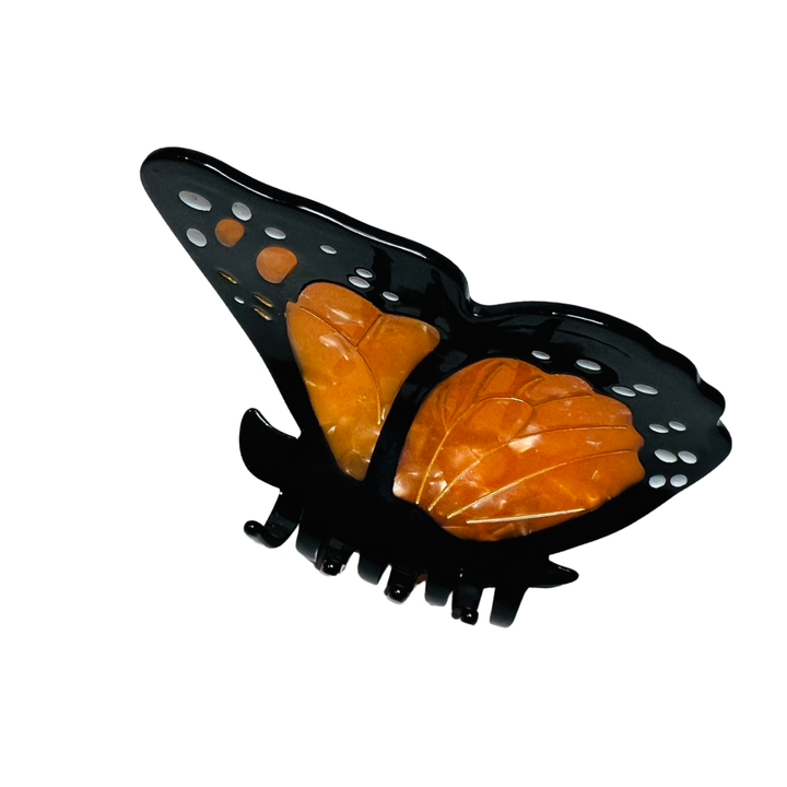 side view of orange, black and white  monarch butterfly hair clip