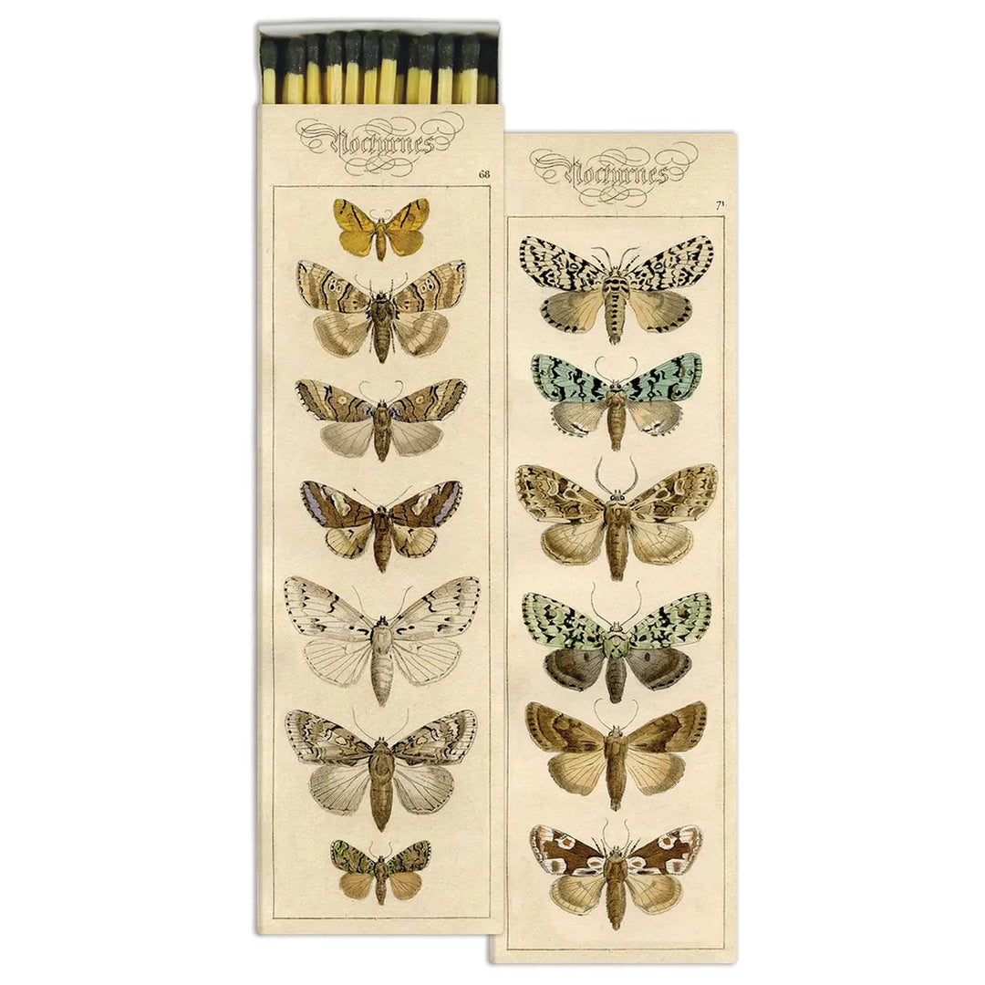 Rectangular matchbox with a vintage-style design featuring detailed illustrations of various moth species arranged in columns on a cream background. The open box reveals long, black-tipped matches.