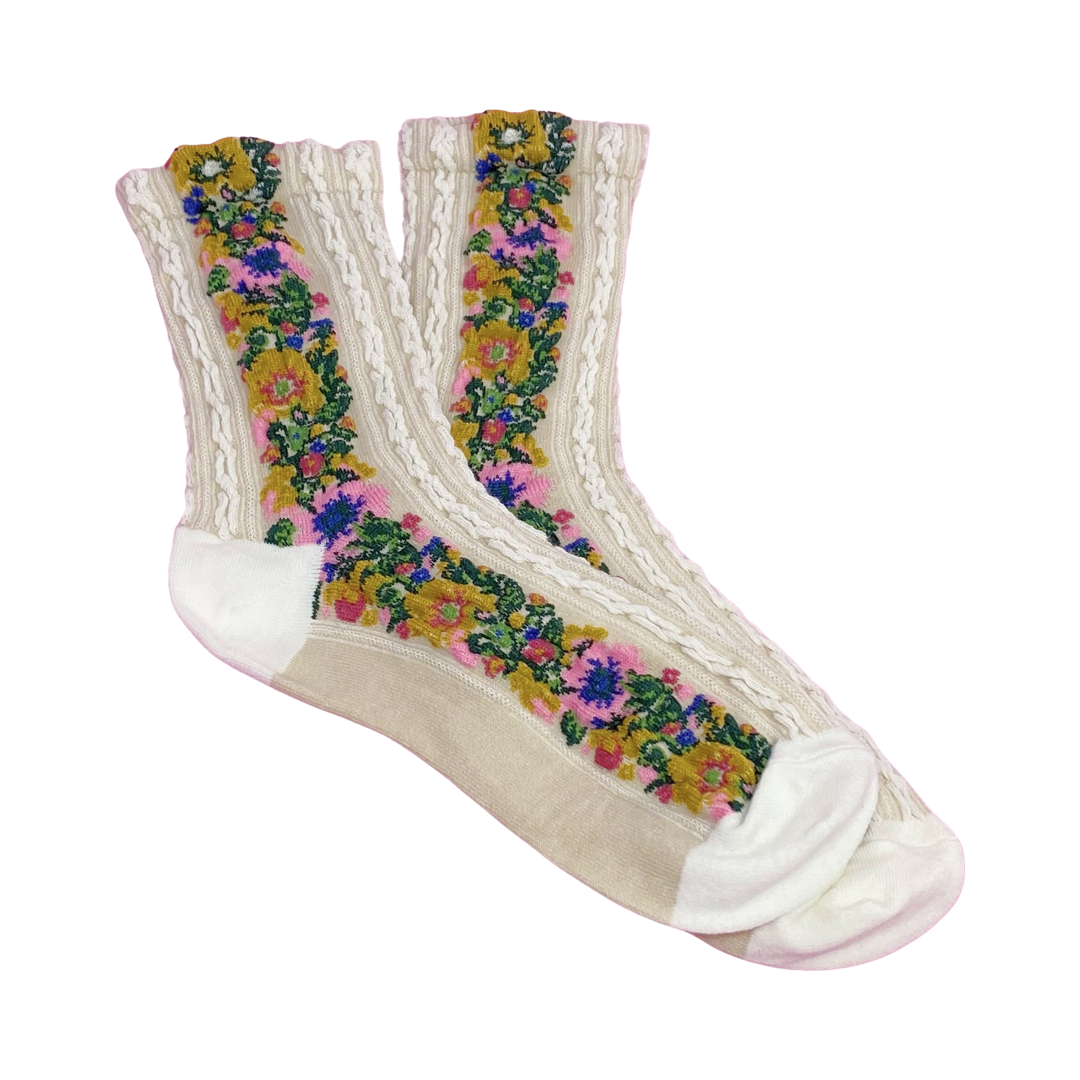 cream colored pair of socks with a knitted floral pattern on the side