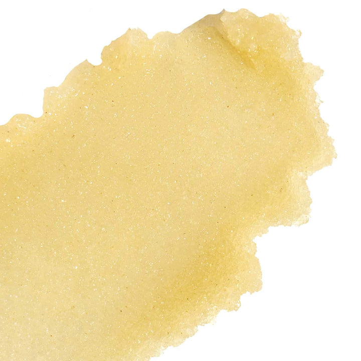 Close up texture of Nopalera Cactus Body Polish in a warm golden yellow sugar scrub consistency.