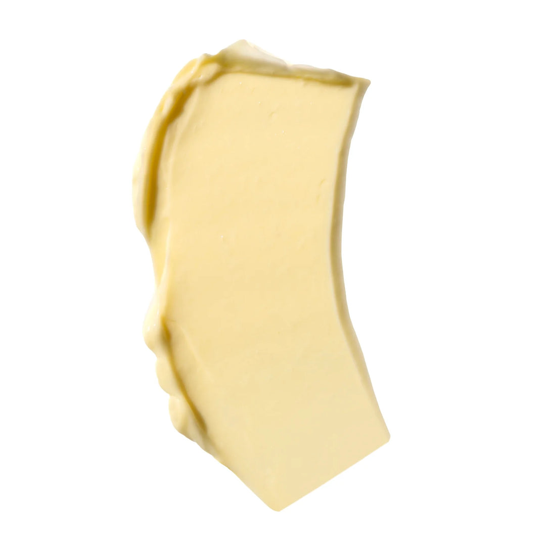 A dollop of thick yellow Nopalera Cream on a white background.