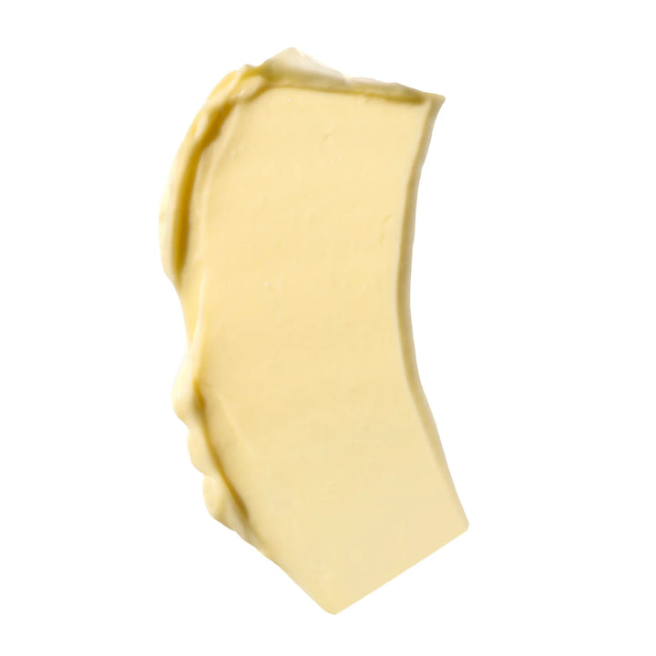 A dollop of thick yellow Nopalera Cream on a white background.