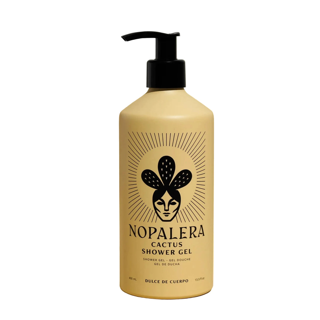 13.5 oz beige bottle of cactus shower gel featuring an image of a woman wearing a cactus crown. Brand: Nopalera