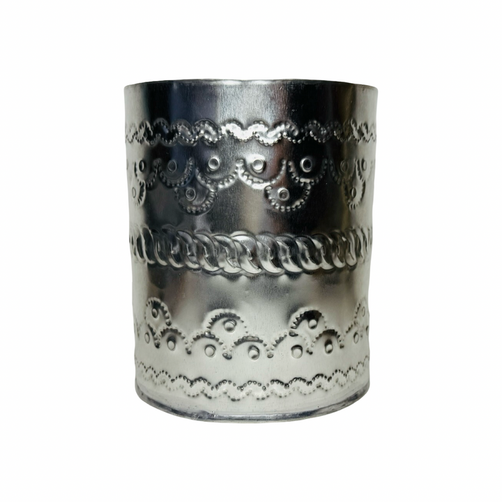 Decorative silver tin can with intricate patterns