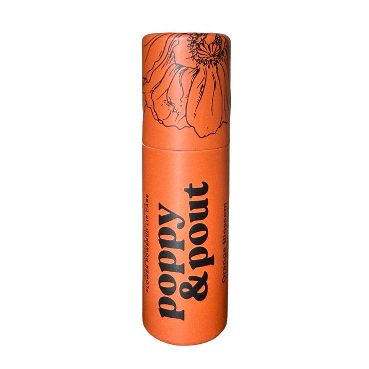 Eco-friendly lip balm tube labeled “poppy & pout” with matching cap.