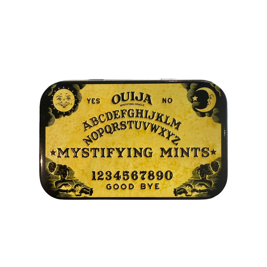 Gold and Black tin with vintage Ouija board design labeled Mystifying Mints.
