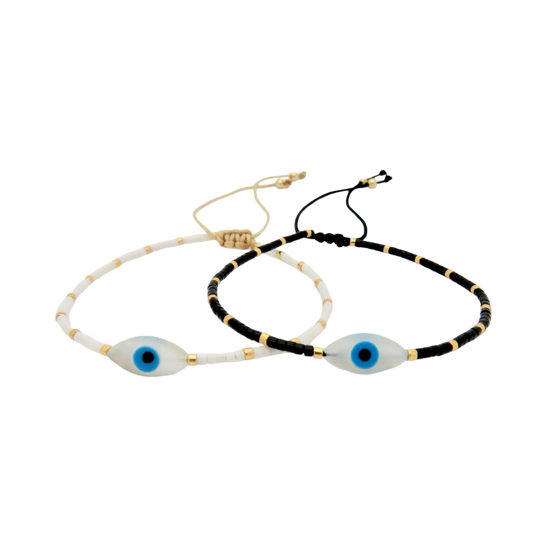 adjustable beaded bracelets featuring a central oval-shaped blue evil eye bead with gold accents.