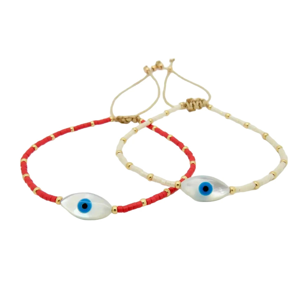 adjustable beaded bracelets featuring a central oval-shaped blue evil eye bead with gold accents.