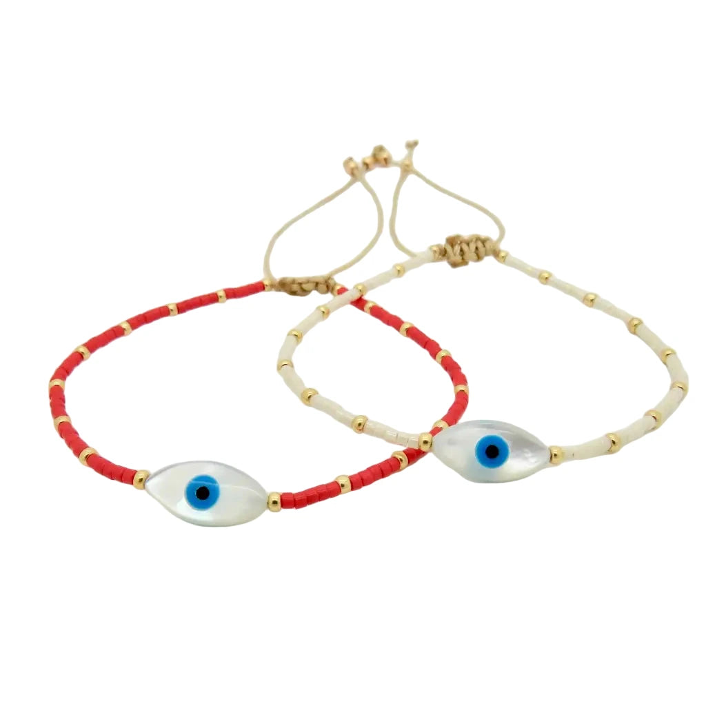 adjustable beaded bracelets featuring a central oval-shaped blue evil eye bead with gold accents.