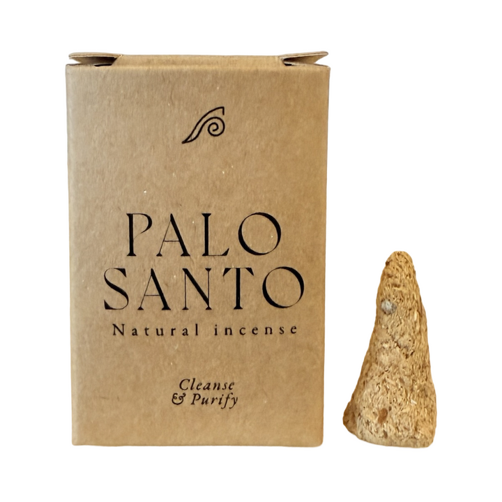 Kraft box of palo santo cones with a cone to the right of it.