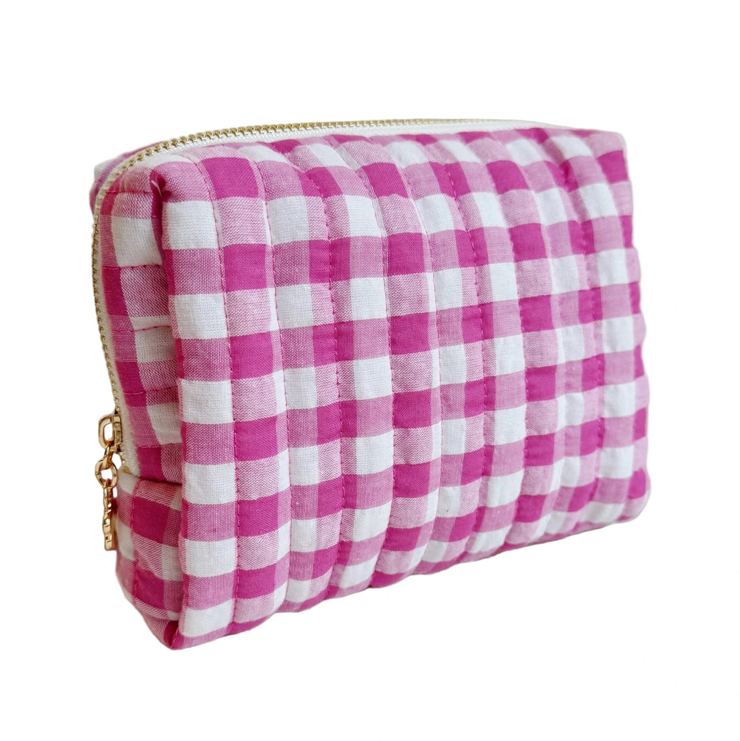 Quilted pink-and-white gingham cosmetic pouch with a gold zipper.