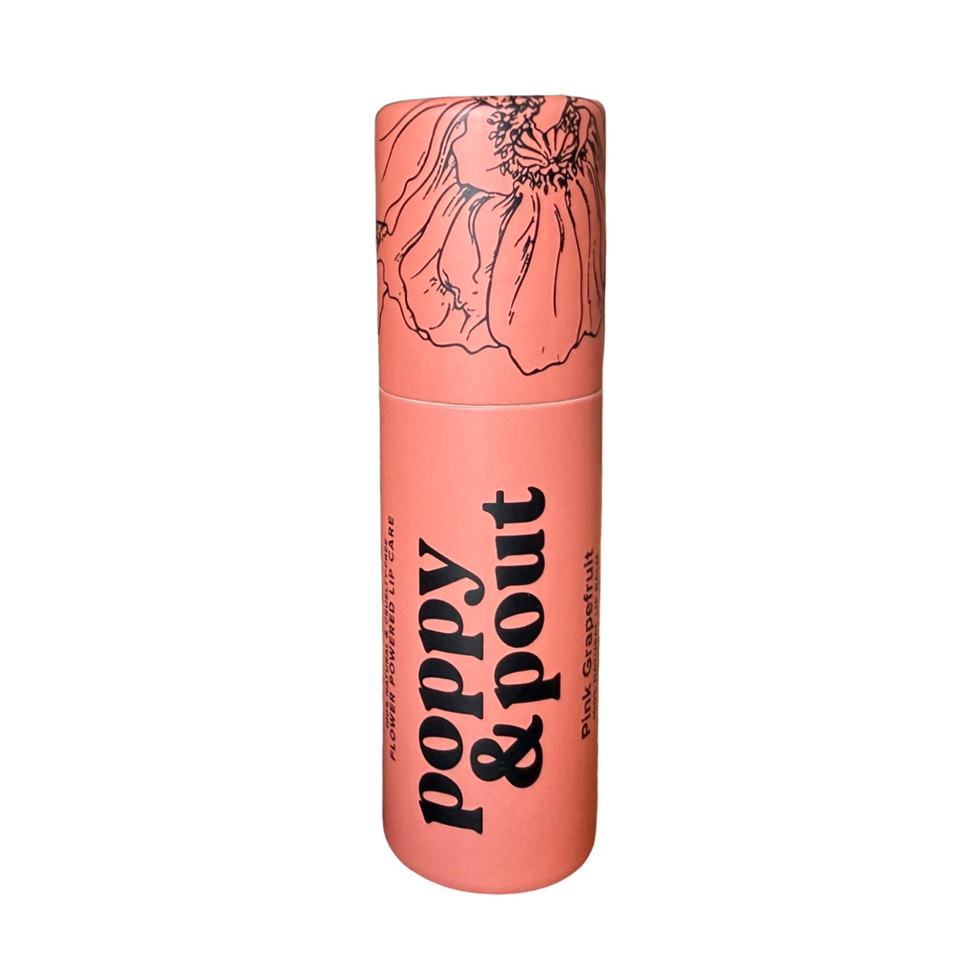 Tube of lip balm labeled “poppy & pout” with matching cap.