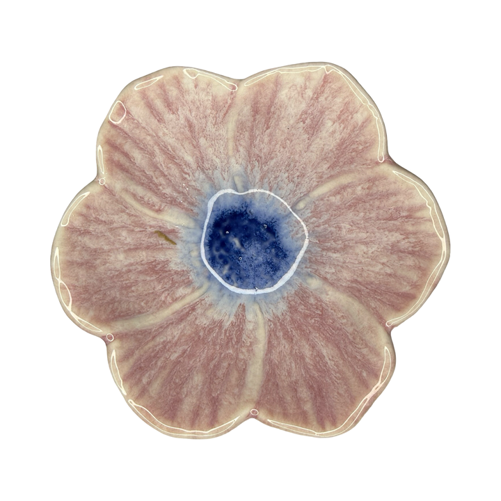 Stoneware flower-shaped bowl in dusty rose with a blue center glaze.