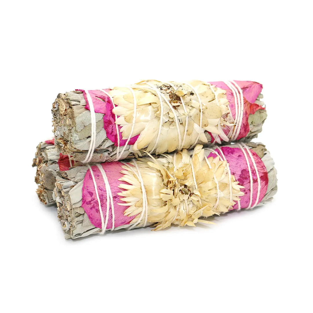 3 bundles of Organic White Sage with Pink Rose Petals and Pearl Daisies tied with white twine.