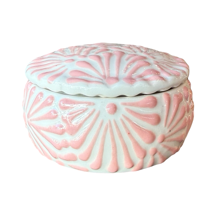 White ceramic lidded jar with pink talavera design.