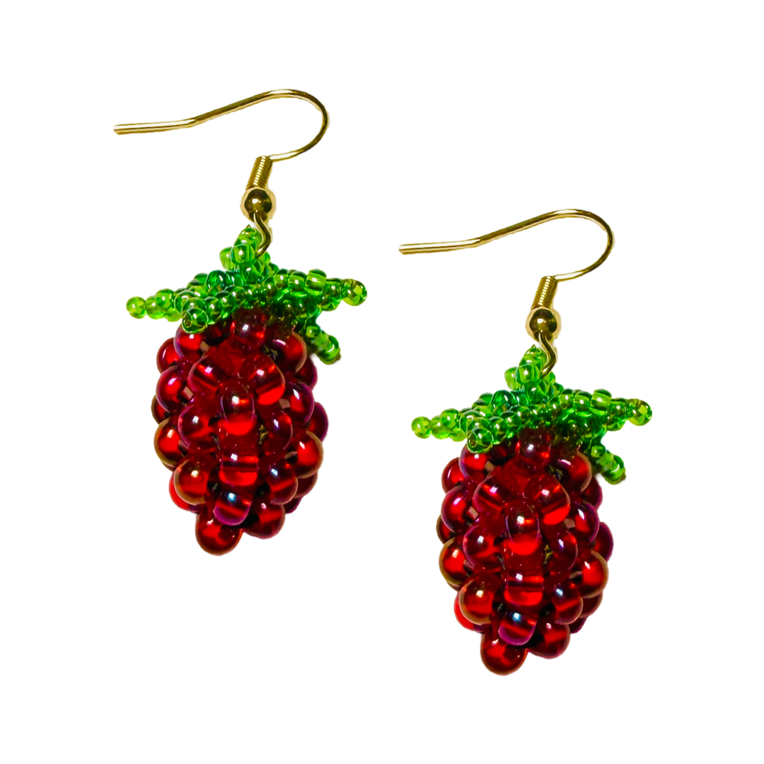 Beaded raspberry drop earrings with green seed bead leaves and gold fish hooks.
