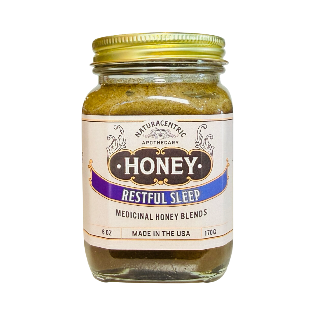 A 6 oz glass jar of Naturacentric Apothecary Restful Sleep infused honey with a black lid and vintage-style label.