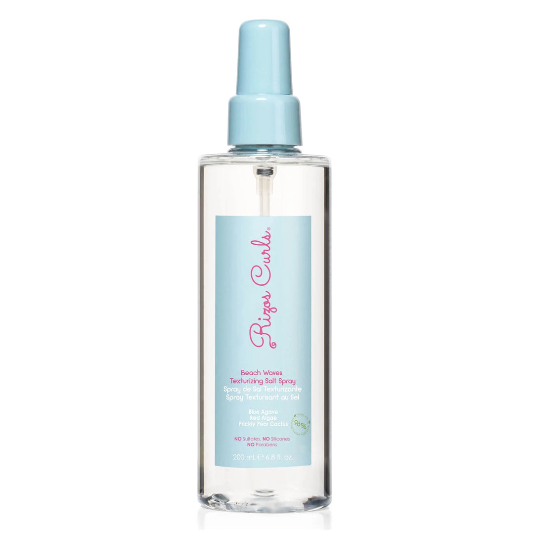 clear 6.8 oz spray bottle with a powder blue branded label with pink lettering. Brand: Rizos Curls