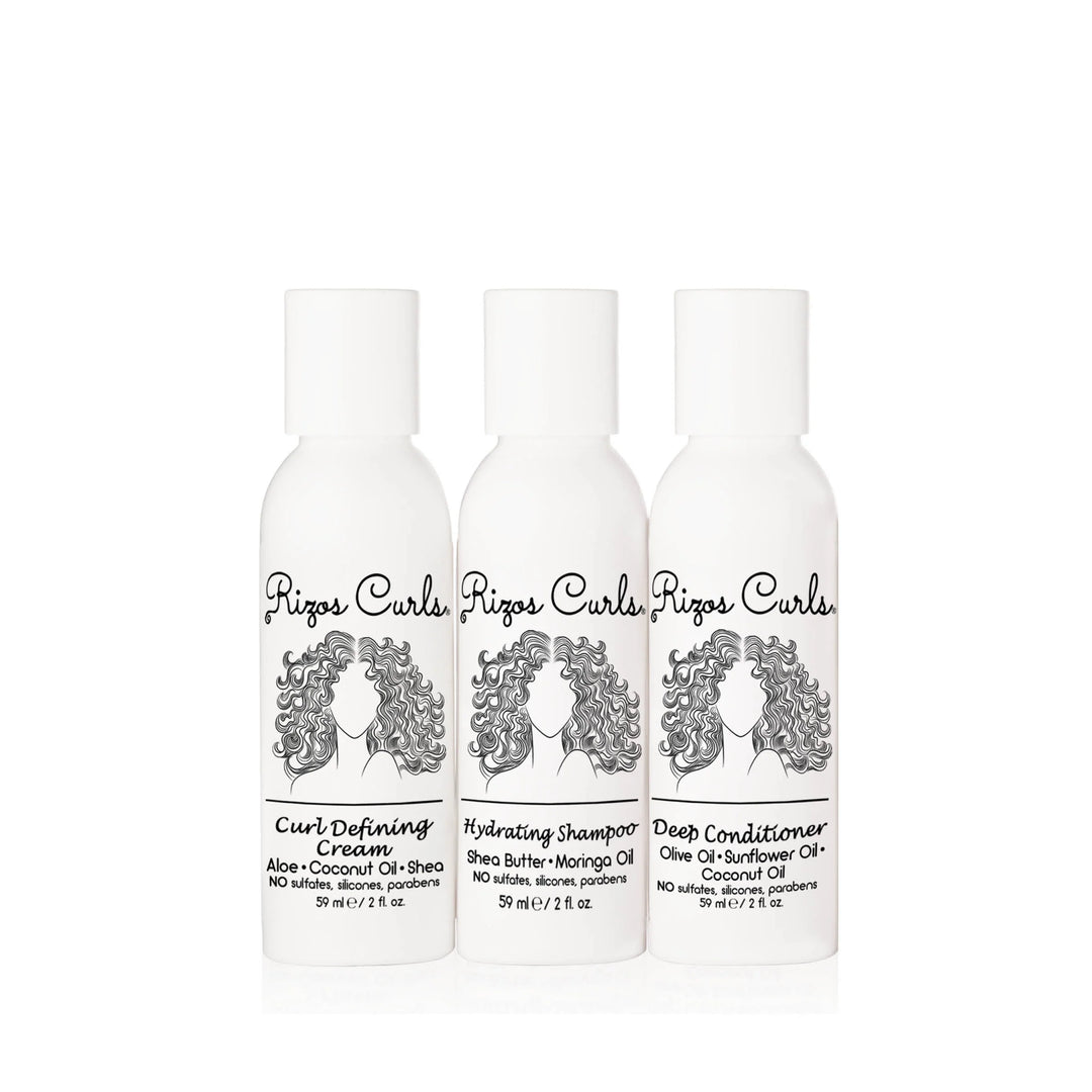 three 2 oz white branded bottles with an illustration of a woman with curly hair. Brand: Rizos Curls