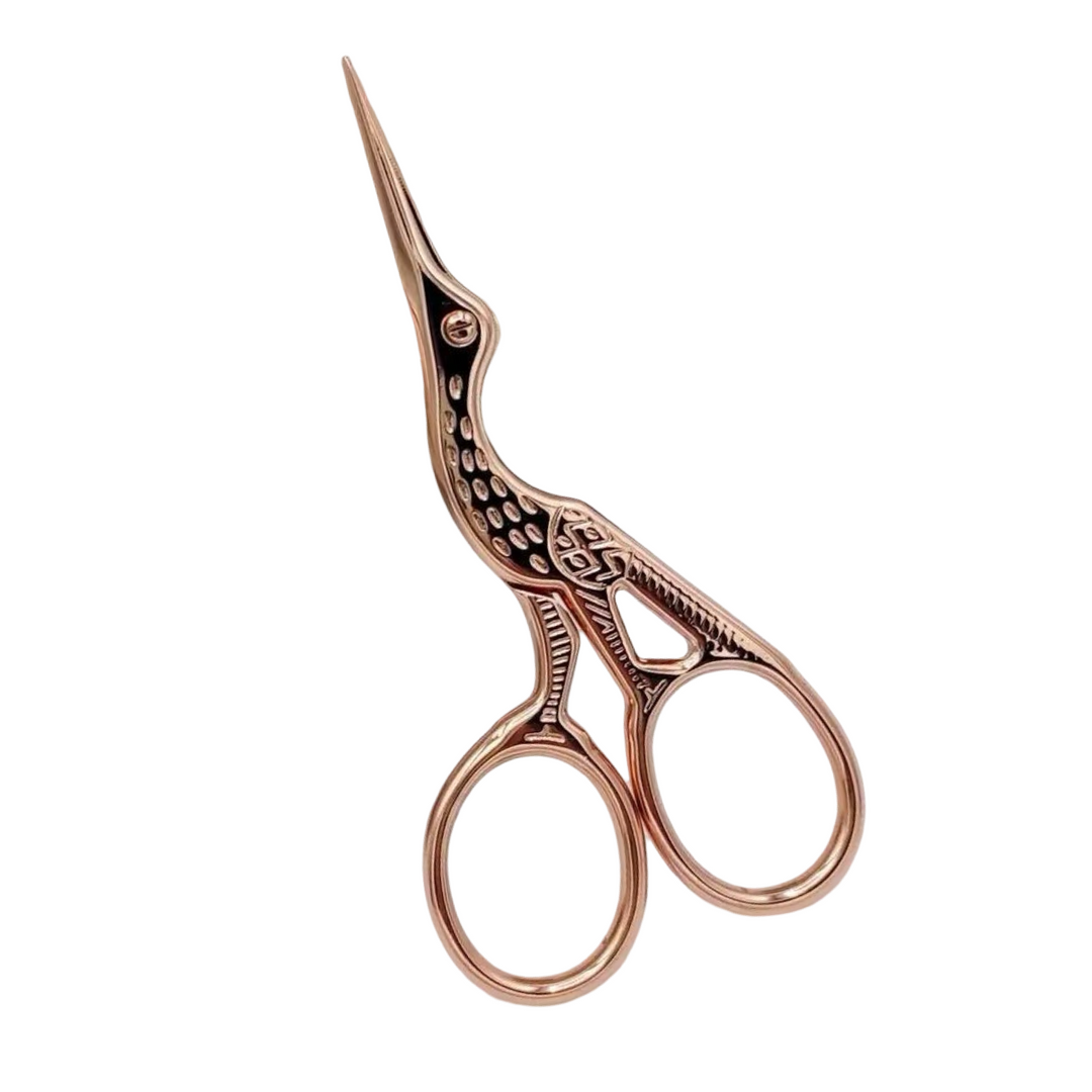 Rose gold stork shaped scissors
