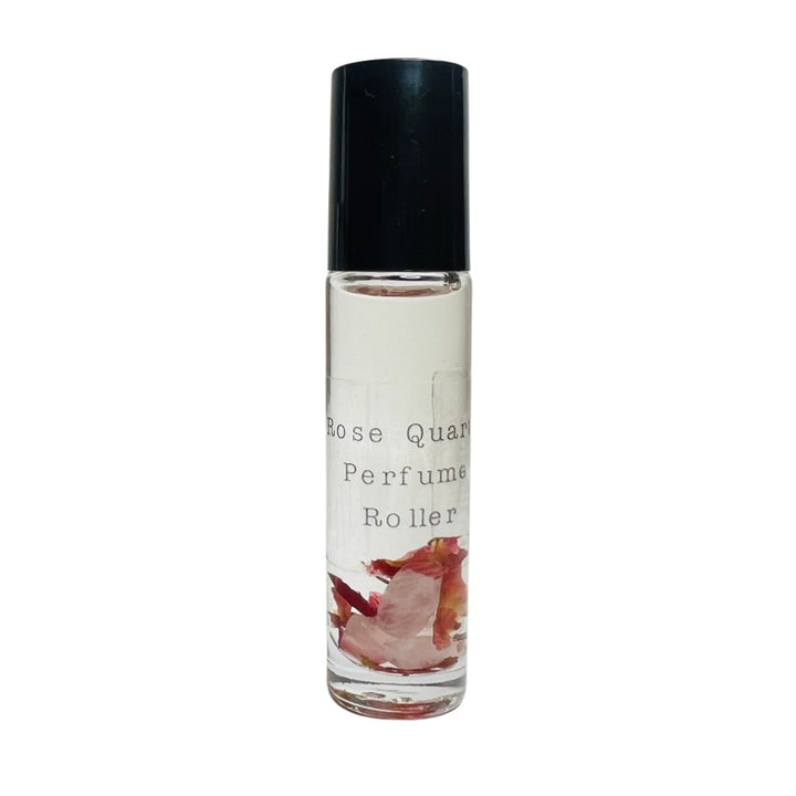 clear glass tube of perfume oil with quartz crystals